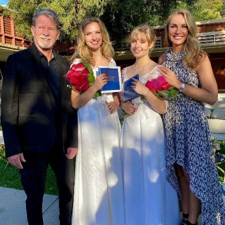 Eva Halina Rich and her husband of two decades, Christopher Rich, took a picture with their daughters on their graduation day.